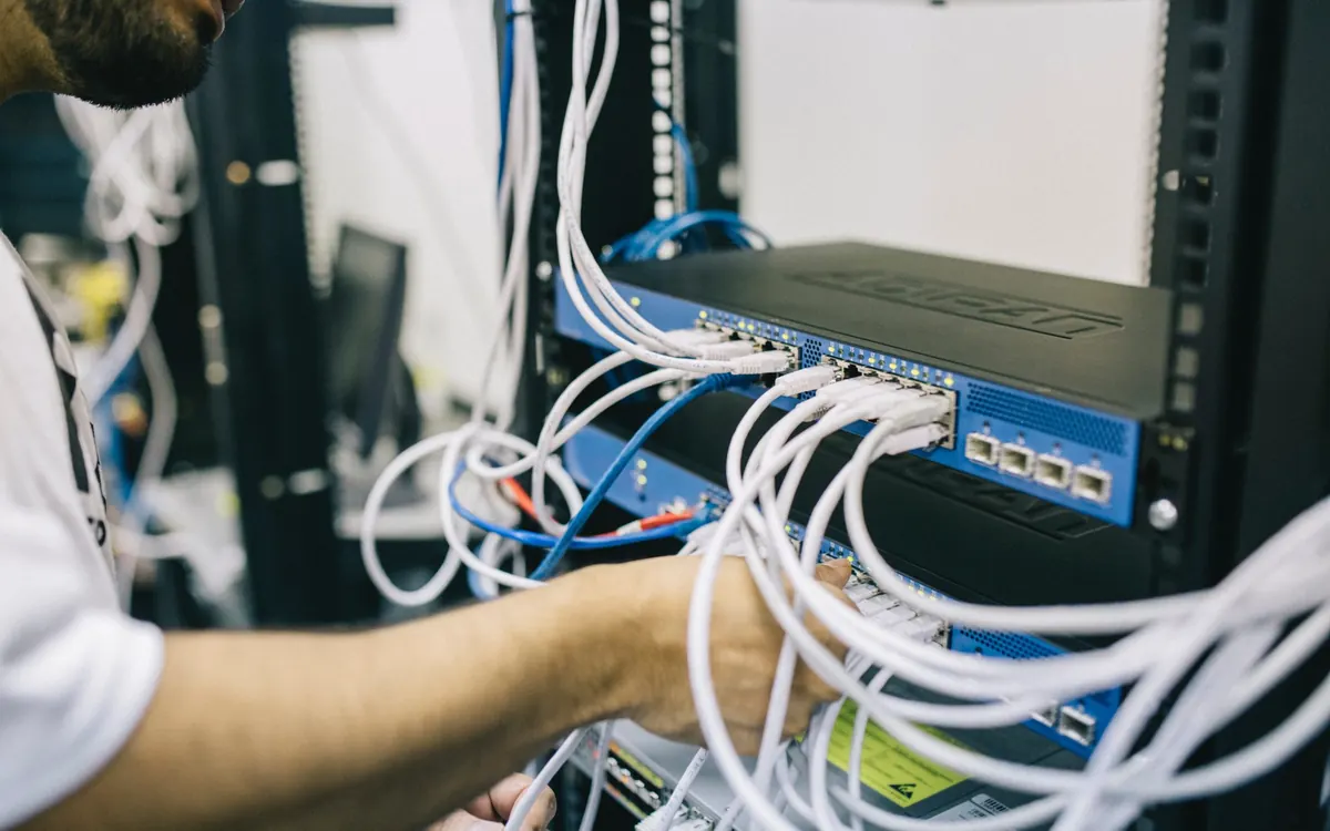 A technician working on server cabling